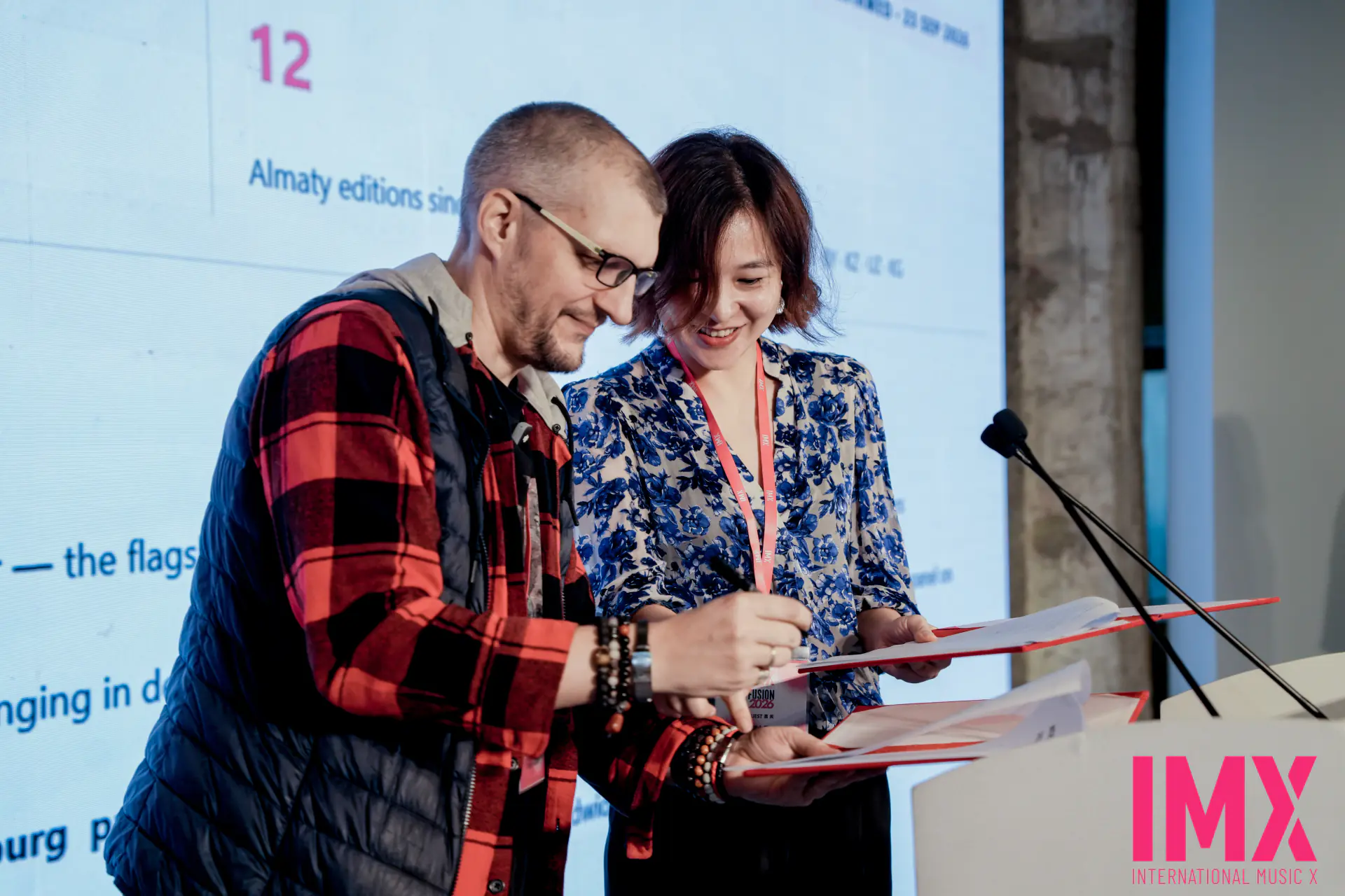 On-stage signing ceremony expanding the International Music Alliance