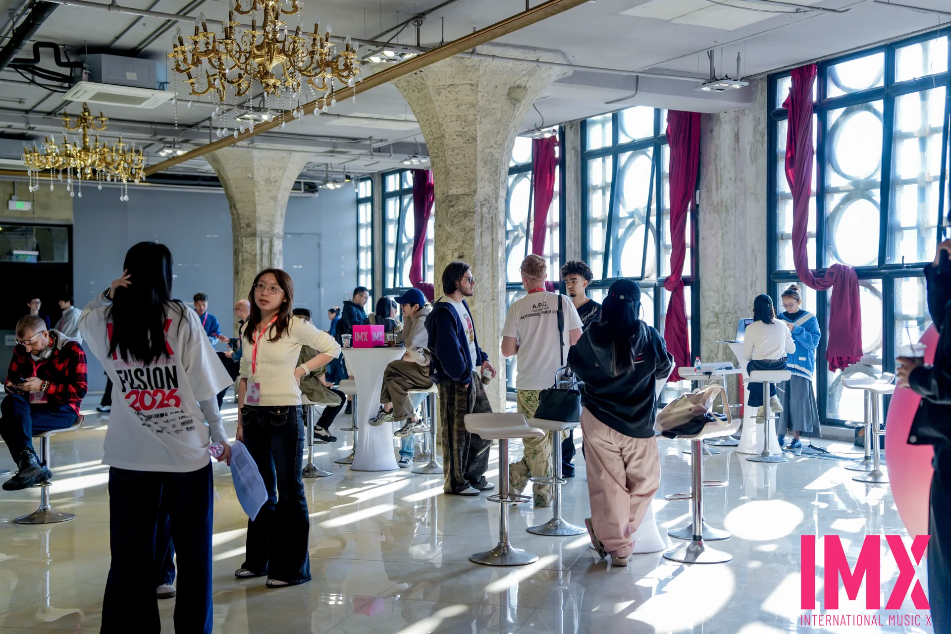 Sunlight illuminating the historic concrete corridors and networking lounge at 1933 Shanghai